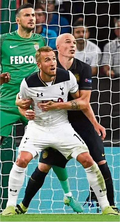  ??  ?? Marked man:
Tottenham Hotspur’s Harry Kane is held by Monaco’s Andrea Raggi in the Champions League Group E match at Wembley on Wednesday. Below: Sunderland’s new signing Didier Ndong is set to start against Tottenham in the English Premier League...