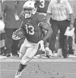  ?? MATT KARTOZIAN-USA TODAY SPORTS ?? Cardinals receiver Christian Kirk returns a punt during the first half vs. the Chargers at University of Phoenix Stadium.