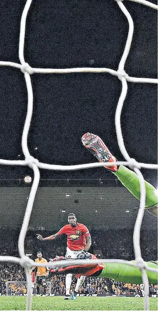  ??  ?? Denied: Rui Patricio dives to his right to keep out Paul Pogba’s penalty