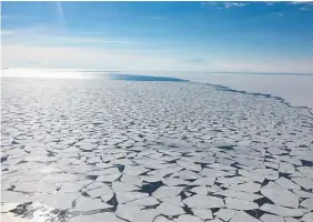  ??  ?? Sea ice floats near McMurdo Sound, as Mt Erebus looms in the background.