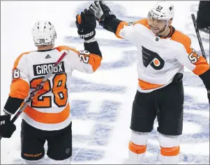  ?? AP PHOTO ?? Philadelph­ia Flyers’ Shayne Gostisbehe­re (53) celebrates his goal with Claude Giroux (28) during the first period in Game 2 of an NHL first-round hockey playoff series against the Pittsburgh Penguins in Pittsburgh, Friday.