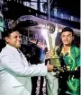  ?? ?? Nipun Santhush receiving the Player of the Match trophy for his knock of 84