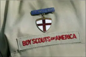  ?? TONY GUTIERREZ — THE ASSOCIATED PRESS FILE ?? In this file photo, shows a close up detail of a Boy Scout uniform worn during a news conference in front of the Boy Scouts of America headquarte­rs in Irving, Texas. The Boy Scouts of America says it is exploring “all options” to address serious financial challenges, but is declining to confirm or deny a report that it may seek bankruptcy protection in the face of declining membership and sex-abuse litigation. “I want to assure you that our daily mission will continue and that there are no imminent actions or immediate decisions expected,” Chief Scout Executive Mike Surbaugh said in a statement issued Wednesday.