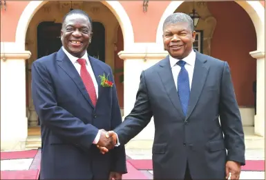  ??  ?? President Mnangagwa is welcomed by Angolan President Joao Lourenco in Luanda yesterday. President Lourenco chairs the Sadc Organ on Politics, Defence and Security