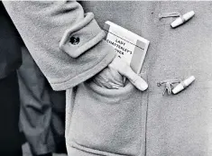  ?? ?? Into the duffel-coat pocket for a newly bought copy of D H Lawrence’s novel, 1960