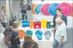  ?? OU DELI / FOR CHINA DAILY ?? Visitors seek details about products on display from exhibitors at the 121st Canton Fair, which concluded last fortnight in Guangzhou, Guangdong province.