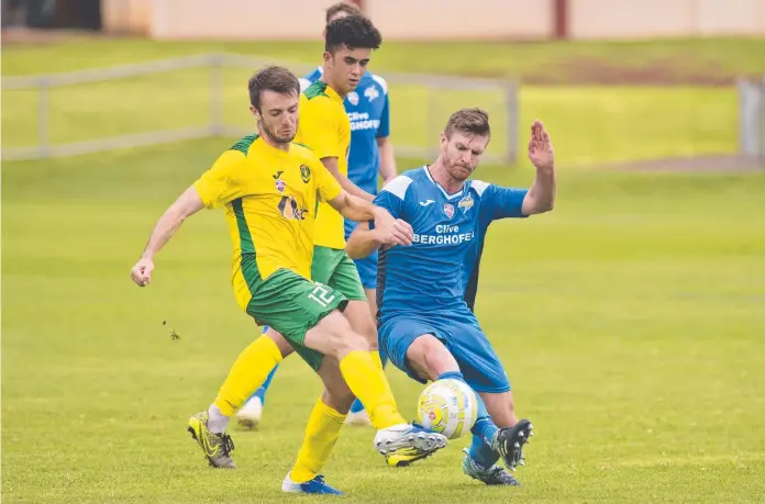  ?? Picture: Kevin Farmer ?? CLOSE BATTLE: South West Queensland Thunder defender Brenton Pennells (right) closes down Rochedale Rovers’ Declan Rydings. Rovers won the FQPL match held at Clive Berghofer Stadium 3-1.