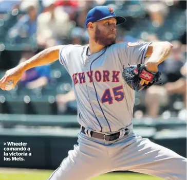  ?? FOTO: AP ?? > Wheeler comandó a la victoria a los Mets.