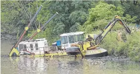  ?? CATHIE COWARD THE HAMILTON SPECTATOR FILE PHOTO ?? The dredging machine that’s being used to clean Chedoke Creek.