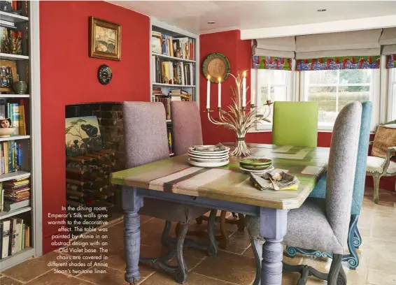  ??  ?? In the dining room, Emperor’s Silk walls give warmth to the decorative effect. The table was painted by Annie in an abstract design with an Old Violet base. The chairs are covered in different shades of Annie Sloan’s two-tone linen.