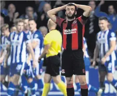  ??  ?? Tough time: Crusaders captain Colin Coates shows his dejection