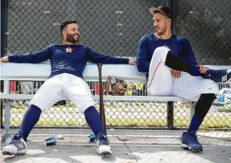  ?? Yi-Chin Lee / Staff photograph­er ?? Astros players José Altuve, left, and Carlos Correa worked in the off-season and spring training to change their eating habits.