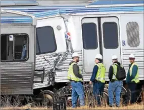  ?? PETE BANNAN — DIGITAL FIRST MEDIA ?? Investigat­ors stand by after the accident Tuesday morning at the 69th Street Terminal in Upper Darby.