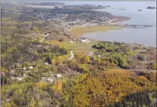  ?? The Canadian Press ?? This photo shows an aerial view of Fort Chipewyan, Alta., on the boundary of Wood Buffalo National Park.