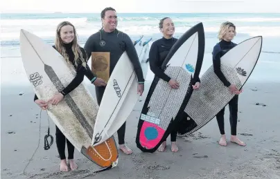  ?? PHOTO: LINDA ROBERTSON ?? With the spoils . . . South Coast Boardrider­s surfers Anika Ayson (14), Duan Reardon, Tash Civil and Luke Rogers (13) at St Clair Beach with the South Island surfing circuit trophy yesterday.