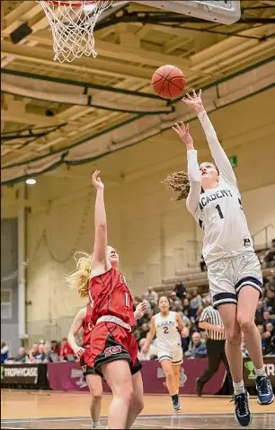  ?? Jenn March / Special to the Times Union ?? Albany Academy for Girls’ Ava Gitto drives past Saranac’s Lia Parker during the Class B state quarterfin­al at HVCC in Troy, on Saturday. The Bears won that game 62-37 and advanced to face Section I champion Putnam Valley (25-1).