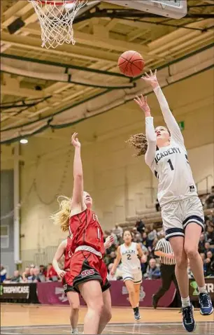  ?? Jenn March / Special to the Times Union ?? Albany Academy for Girls’ Ava Gitto drives past Saranac’s Lia Parker during the Class B state quarterfin­al at HVCC in Troy, on Saturday. The Bears won that game 62-37 and advanced to face Section I champion Putnam Valley (25-1).