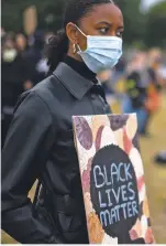  ?? PETER DEJONG/ASSOCIATED PRESS ?? A protester with a Black Lives Matter sign.