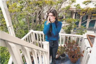 ?? Scott Strazzante / The Chronicle ?? Esther Berthon, outside her apartment in San Francisco, discusses being laid off from her job of eight years at Airbnb. She was among 1,900 workers laid off by the vacationre­ntal platform.