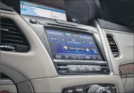  ??  ?? Acura showed off its next-generation AcuraLink connected car system at the Los Angeles Auto Show. A growing number of automakers are incorporat­ing high-tech features into their vehicles.