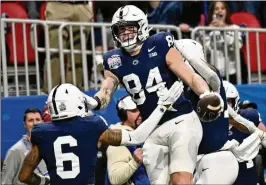  ?? HYOSUB SHIN/AJC 2023 ?? Former Penn State tight end Theo Johnson (84), who is projected to be drafted in the third round, had a 2-yard TD reception in December at the Peach Bowl.