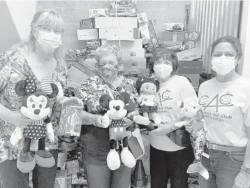  ?? CHILDREN’S AID CLUB PHOTOS ?? From left, Caroline Courtney (Children’s Aid Club president), Irene Feldman, Barbara Hume and Vanessa Font check out the toy donations being housed in a storage facility.