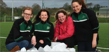  ??  ?? Jane O’Donoghue, Denise Regan, Amelia Tucker and Claire Doherty collecting plastic milk bottles to make an igloo for the Football for All Santa visit and Christmas Party in Celtic Park, Killarney.