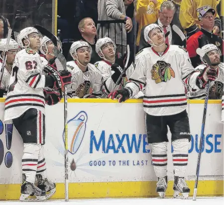  ?? | AP ?? The Hawks watch as a goal by the Predators is reviewed in the third period of Game 4 on Thursday. The goal was ruled good.