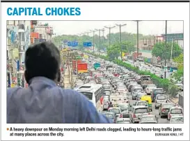  ??  ?? A heavy downpour on Monday morning left Delhi roads clogged, leading to hours-long traffic jams at many places across the city. BURHAAN KINU / HT