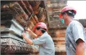  ?? MAO PENGFEI / XINHUA ?? Chinese specialist­s help renovate Ta Keo Temple at the Angkor complex in Cambodia in July.