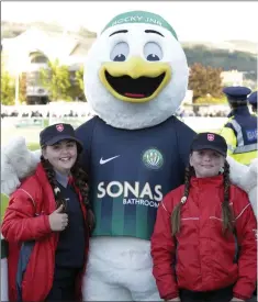  ??  ?? Orla and Niamh O’Toole with the Order of Malta with Rocky Jnr at the Bray Wanderers v Dundalk match.