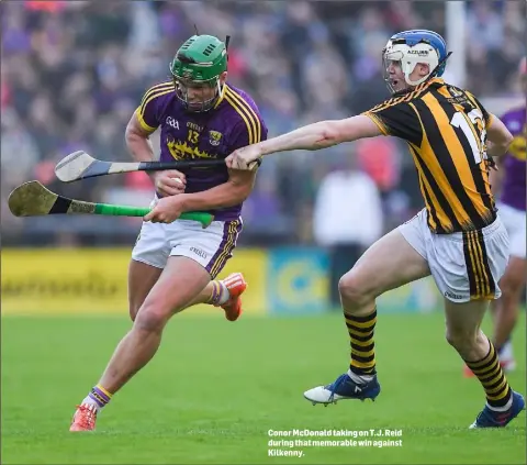  ??  ?? Conor McDonald taking on T.J. Reid during that memorable win against Kilkenny.