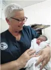  ?? PHOTO: SUPPLIED ?? Saving a young life . . . Invercargi­ll nurse Anne Dymond holds baby Annegelo — a baby she delivered while at Leulemoega Hospital in Samoa while helping with the measles epidemic.