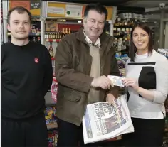  ??  ?? Liam Corrigan collects his €20 prize from Martin Kacki of Spar Express, Monastery, Enniskerry, and Donna Murphy.