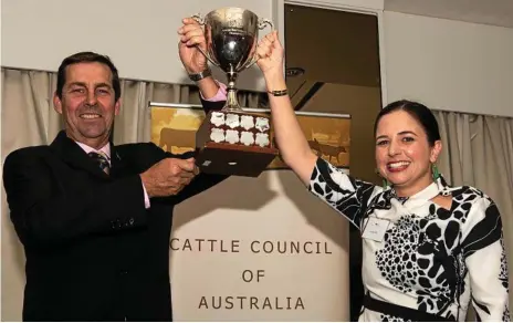  ?? Photo: Contribute­d ?? PROUD MOMENT: Cattle Council president Howard Smith presents Jim’s Jerky CEO Emily Pullen with the 2019 NAB Agribusine­ss National Rising Champion trophy.