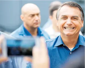  ?? CAROLINA ANTUNES/PR-4/9/2020 ?? Sem usar a Bic. Presidente Bolsonaro pediu sacrifício e disse que não vai dar ‘canetada’