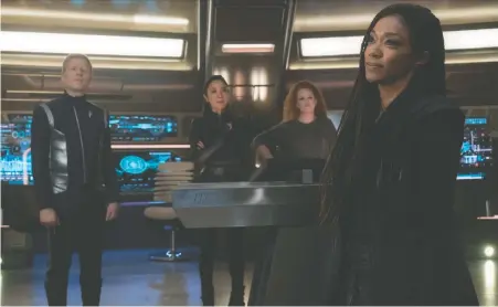  ?? MICHAEL GIBSON/ CBS ?? In season 3 of Star Trek: Discovery, Sonequa Martin-Green's character, right, returns to her crew a changed person.