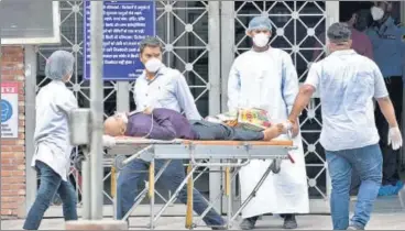  ?? ANI ?? A patient suffering from COVID19 arrives at LNJP Hospital in New Delhi on Tuesday.