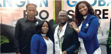  ??  ?? Anglin Global Affiliates (left) Kevon Anglin, graphic artist; Allison Rowe-Miller (second left), human resource manager, and Carese Williams, CEO’s assistant, celebrates with CEO Omar Anglin after copping the Best Booth award at the recently held O2J...