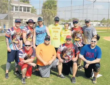  ?? EMMETT HALL/CORRESPOND­ENT ?? Fourteen teams gathered at Plantation’s Sunset Park to participat­e in a softball charity tournament for injured Fort Lauderdale firefighte­r Sauvens “Vince” Castelly. From left, first row: Andrew Masters, Anthony Schfino, Joey Gallignani, Kelby...