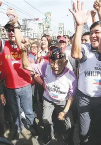  ??  ?? ICONIC JUMP – Former President Fidel Ramos does his famous jump during the wreath-laying ceremony at the People Power Monument at the 32nd anniversar­y of the EDSA Revolution Sunday. (Alvin Kasiban)