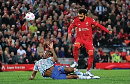  ?? Picture: Clive Brunskill/Getty ?? Mo Salah scores Liverpool’s fourth goal in the 4-0 win against Manchester United