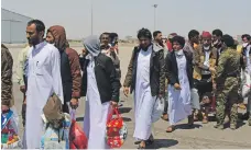  ?? Getty ?? Yemeni fighters who were held by the Houthis and became part of a prisoner swap, arrive in Aden at the weekend