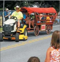  ?? DISPATCH STAFF PHOTO ?? The annual Whitelaw Old Home Day Parade on Saturday, Aug. 2, 2014. A recent study by The Washington Post, the Vancouver School of Economics, and McGill University found people who live in rural areas and small towns are happier than their urban-living...