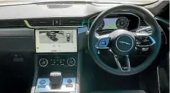  ??  ?? Interior improvemen­ts include a larger screen, a traditiona­l gear selector, and swathes of high-quality materials.
