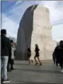  ?? JACQUELYN MARTIN - THE AP ?? Joggers pass the Martin Luther King Jr. Memorial, Thursday, Dec. 27, in Washington, during a partial government shutdown. President Donald Trump has vowed to hold the line on his budget demand, telling reporters during his visit to Iraq Wednesday that he’ll do “whatever it takes” to get money for border security.