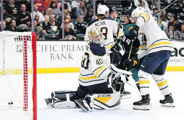  ?? HARRY HOW/GETTY IMAGES ?? Anaheim Ducks rookie Sam Steel, a former star with the Regina Pats, beats Buffalo Sabres goaltender Carter Hutton for his first NHL goal on Oct. 21.