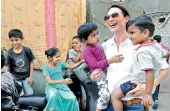  ?? — P. SURENDRA ?? English actress, Claire Antonia Forlani, interacts with children in Kaladera at Malakpet on Tuesday. The meet was organised by the Internatio­nal Union against Tuberculos­is and Lung Disease.