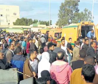  ?? GETTY IMAGES ?? Egyptians gather around ambulances following an attack on a mosque Bir al-Abd, Egypt on Friday, the deadliest attack on civilians in the country by Islamic militants.