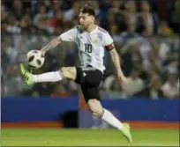  ?? NATACHA PISARENKO — THE ASSOCIATED PRESS FILE ?? Argentina’s Lionel Messi controls the ball during a friendly soccer match between Argentina and Haiti at the Bombonera stadium in Buenos Aires, Argentina.